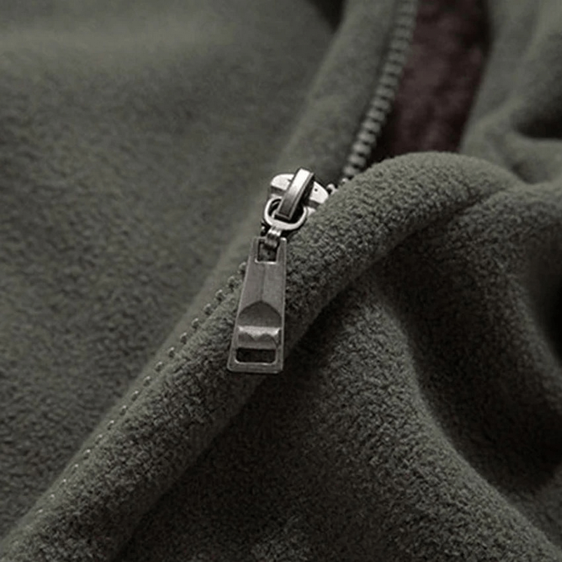 Close-up of solid color men's jacket with stand collar and zipper, showcasing luxurious cotton fabric for casual warmth and style.